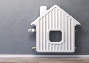 Heizung in Form eines Hauses auf der Wand