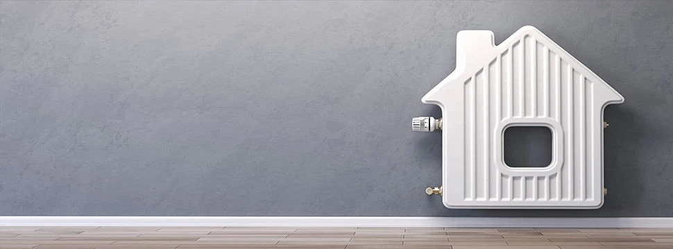 Heizung in Form eines Hauses auf der Wand